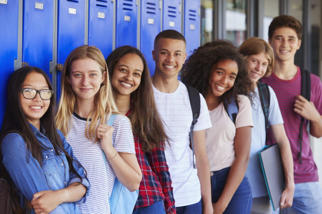 A group of young people standing next to each other.