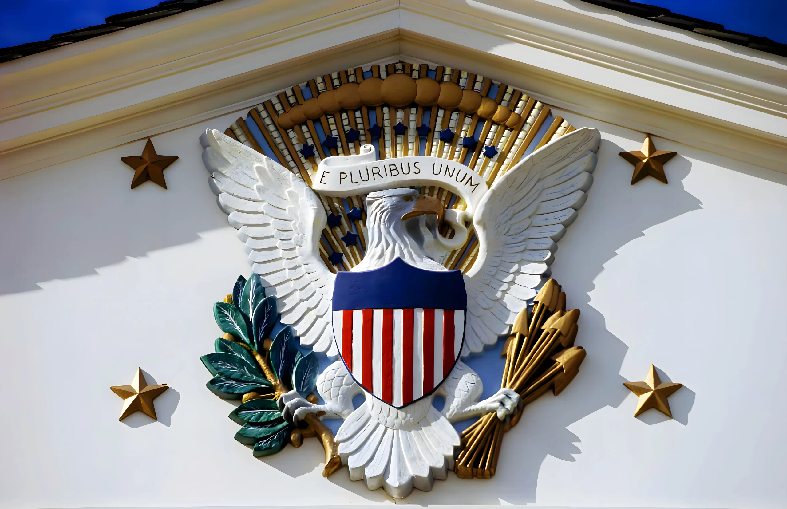 A large eagle with an american flag on it's wings.